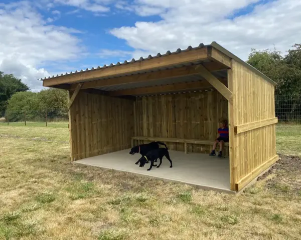 Book our dog park - Vine House Dog Park 3 - Vine House Farm Dogs in a shelter at Vine House Farm Shop Dog Park